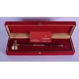 A BOXED SILVER AND WOOD CANDLE SNUFFER by Frazer and Haws. 72 grams. 27 cm long.