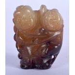 AN EARLY 20TH CENTURY CHINESE CARVED MUTTON JADE FIGURE Late Qing/Republic, modelled as a boy and ca