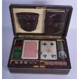 A CHARMING EARLY 20TH CENTURY LEATHER CASED GENTLEMANS GAMING BOX with unusual musical box features