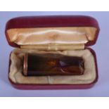 AN ANTIQUE AMBER CHEROOT HOLDER. 4.75 cm long.