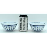 A pair of Chinese porcelain blue and white rice bowls decorated with calligraphy. 6 x 12cm (2)