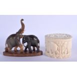 A 19TH CENTURY MIDDLE EASTERN RHINOCEROS HORN FIGURE OF ELEPHANTS together with a carved ivory box a