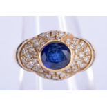 AN 18CT DIAMOND AND SAPPHIRE RING. Size M, weight 8
