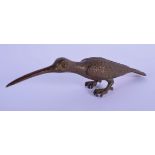 A JAPANESE BRONZE OKIMONO IN THE FORM OF A BIRD WITH A LONG BILL. 13cm x 3cm, weight 104g