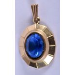 A 9CT GOLD PENDANT INSERT WITH A BLUE STONE. 2.7cm x 1.7cm, weight 2.44g