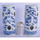 A LARGE PAIR OF 19TH CENTURY CHINESE BLUE AND WHITE PORCELAIN WIG STANDS Qing, painted with dragons