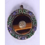 A CHINESE SILVER, ENAMEL AND TIGERS EYE PENDANT. 3.6cm diameter, weight 8g