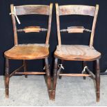 A pair of wooden scroll back Windsor chairs 82 x 42cm x 44cm (2)