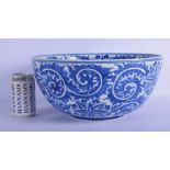 A LARGE 19TH CENTURY CONTINENTAL BLUE AND WHITE PORCELAIN BOWL well painted with bold floral sprays.