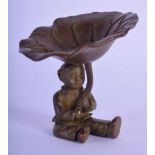 A JAPANESE OKIMONO OF A BOY HOLDING A LILY PAD. 6cm x 6cm, weight 116g
