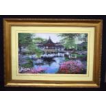A large framed Japanese silk picture of a property by a lake 44 x 74 cm.