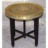 A heavily embossed brass top table decorated with birds 60 x 60 cm .