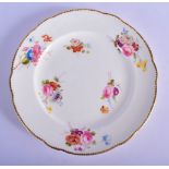 Nantgarw plate c.1818-20, painted with small arrangements of colourful British flowers reserved on a