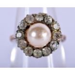 AN 18CT GOLD RING WITH A PEARL SURROUNDED BY WHITE GEMS. Size M, weight 4.46g