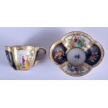 A CONTINENTAL MINIATURE PORCELAIN UP AND SAUCER DECORATED WITH FIGURES AND FLOWERS. Cup 3.5cm high,