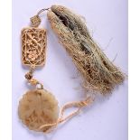 AN ANTIQUE CHINESE JADE AND IVORY ABSTINENCE PENDANT. Jade 5.2cm diameter, Ivory 5cm long