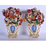 A PAIR OF 19TH CENTURY FRENCH PARIS PORCELAIN VASES painted with flowers. Porcelain 19 cm x 14 cm.