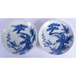 A PAIR OF 18TH CENTURY JAPANESE EDO PERIOD BLUE AND WHITE PORCELAIN DISHES painted with trees and fo