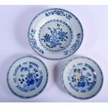 THREE EARLY 18TH CENTURY CHINESE BLUE AND WHITE PORCELAIN PLATES Yongzheng/Qianlong, painted with fl