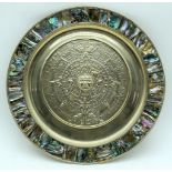 A Silver plate repousse South American plate with abalone shell decoration 28cm.