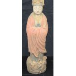 A large wooden Chinese Tibetan figure of a standing monk 56cm.