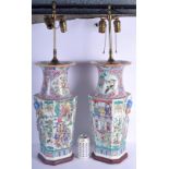 A LARGE PAIR OF 1950S CHINESE FAMILLE ROSE PORCELAIN SQUARE FORM VASES converted to lamps, painted w