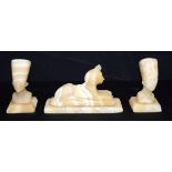 A collection of Grand Tour carved stone Egyptian figures. Largest 13cm. (3)