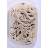 A CHINESE WHITE JADE PENDANT CARVED WITH A DRAGON CHASING A FLAMING PEARL. 5.5cm long, 3.8cm wide