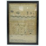 A framed 18th Century sampler dated 1797. 43 x 30cm