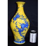 A Chinese porcelain yellow ground vase decorated with peaches and bats. 40cm