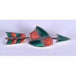 A SILVER AND ENAMEL BROOCH IN THE FORM OF A SHIELD AND AN ARROW. 5.5cm long, 1.8cm wide. WEIGHT 6G