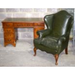 A George III style leather chair and leather topped 9 draw desk .