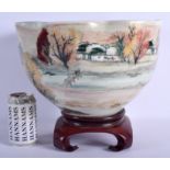 A LARGE CHINESE STUDIO POTTERY SCALLOPED BOWL painted with landscapes. 28 cm x 21 cm.