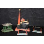 A collection of tin plate industrial working models of a steam engine and a band saw. 28 x 17cm (4)