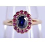 AN 18CT RUBY AND SAPPHIRE CLUSTER RING. Size P, weight 3.49g