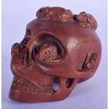 A JAPANESE WOOD SKULL CARVED WITH RATS AND A SNAKE. 7.8cm high, 8.5cm wide, weight 181g