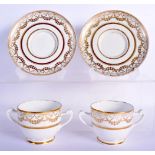 A PAIR OF EARLY 19TH CENTURY TWIN HANDLED GILDED CUPS AND SAUCERS Coalport or Derby, painted with ne