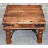A small Indian wooden low table with metal studding. 41 x 60 x 60 cm