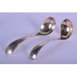 A PAIR OF 19TH CENTURY CONTINENTAL SILVER LADLES. 76 grams. 17 cm long.