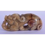 A 20TH CENTURY CHINESE CARVED JADE DOG OF FO. 10.5cm long, 4.2cm high, 3.2cm wide, weight 230g