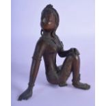 A 19TH CENTURY INDIAN BRONZE FIGURE OF A SEATED FEMALE modelled in a typical stance. 13 cm x 8 cm.