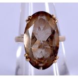 AN ANTIQUE 9CT GOLD AND TOPAZ RING. Size M weight .53g