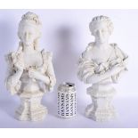 A PAIR OF CONTINENTAL BISQUE PORCELAIN BUSTS Sevres style, modelled holding floral sprays. 36 cm hig