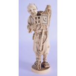 A 19TH CENTURY JAPANESE MEIJI PERIOD CARVED IVORY OKIMONO modelled holding a lantern. 19 cm high.