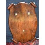 An antique Mahogany hanging coat rack decorated with scrolls in the corners . 75 x 48 cm