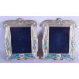 A PAIR OF SILVER AND ENAMEL PHOTOGRAPH FRAMES. 31 cm x 26 cm.