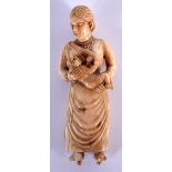 AN 18TH CENTURY ANGLO INDIAN CARVED IVORY FIGURE OF A FEMALE modelled holding a baby. 8.5 cm high.