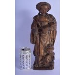 A FINE 16TH CENTURY NORTHERN EUROPEAN CARVED FRUITWOOD FIGURE OF A STANDING FEMALE modelled holding