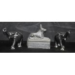 A pair of ebony carved elephants, together with a pottery Egyptian Anubis dog. 19 x 17cm (3)