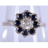 AN 18CT DIAMOND AND SAPPHIRE CLUSTER RING. Size M/N, weight 4.21g